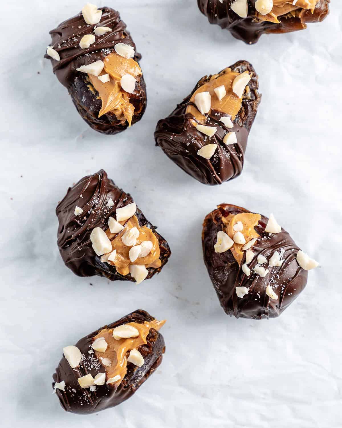 process of adding nuts topping to stuffed dates
