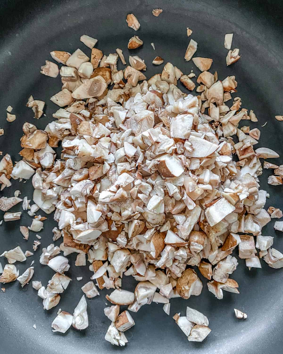 chopped mushrooms on saucepan