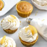 completed lemon vanilla cupcakes on a white surface