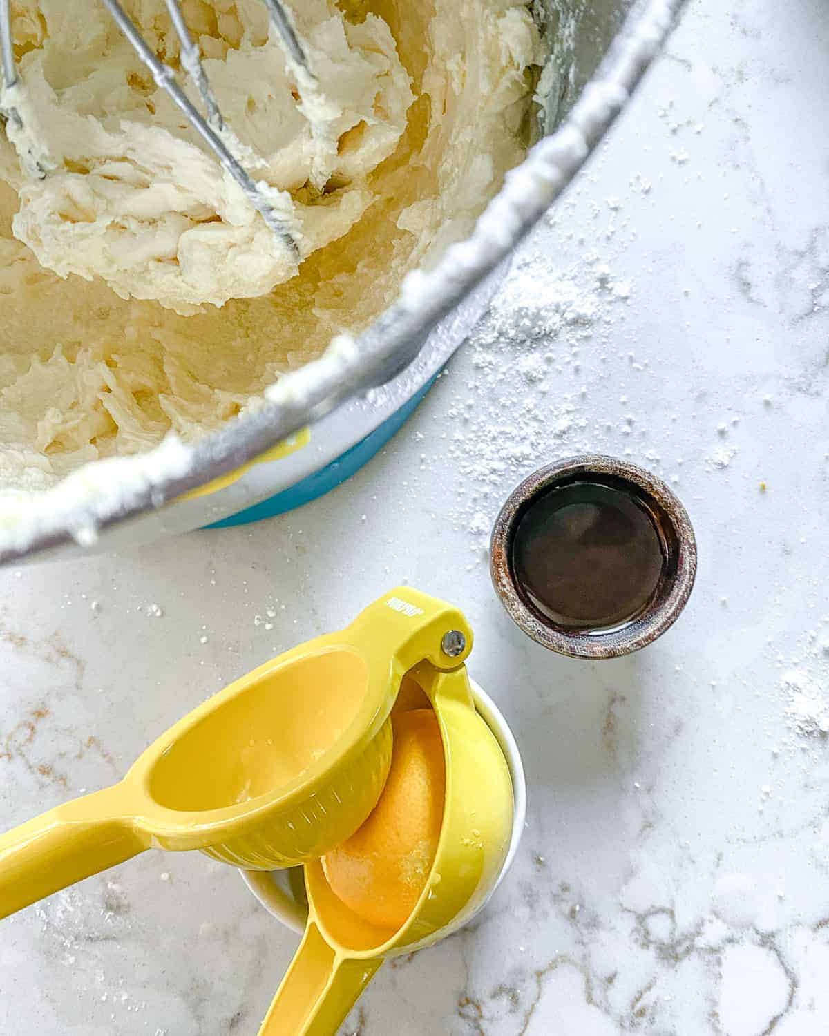 adding lemon juice to batter against white background