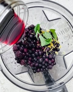 process shot showing juice being added to blender