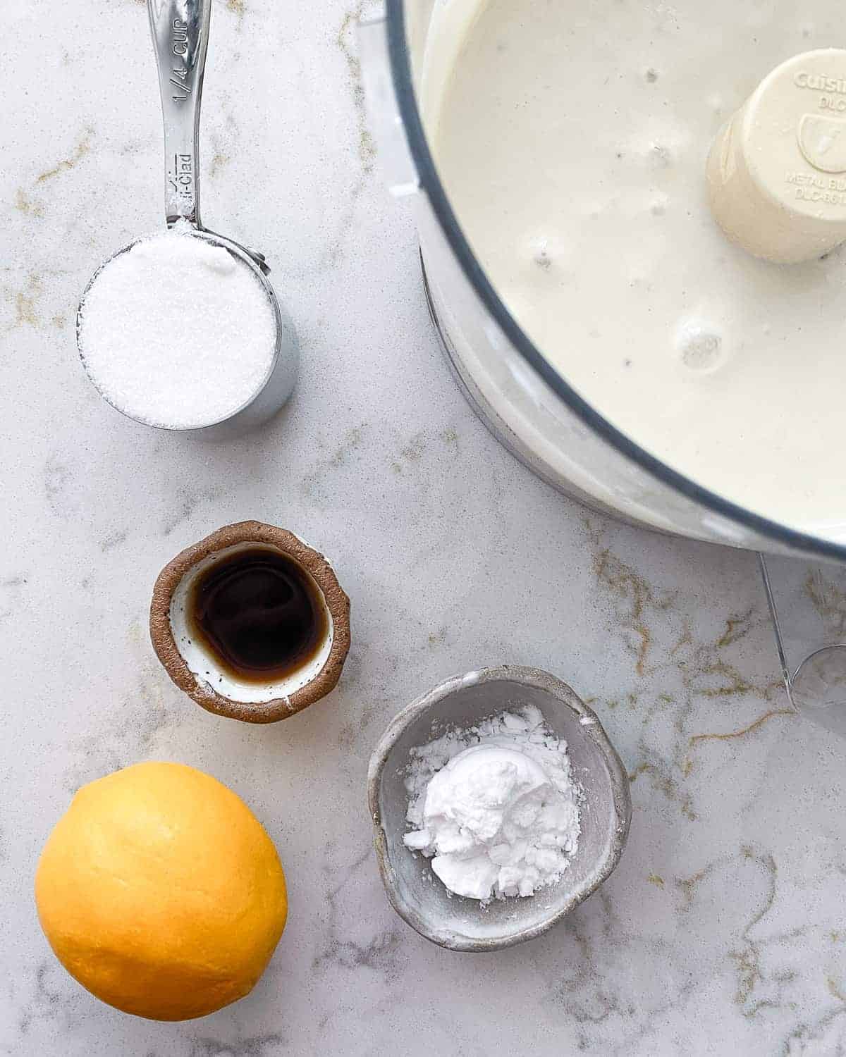 ingredients for banana parfait measured out against a white marble surface