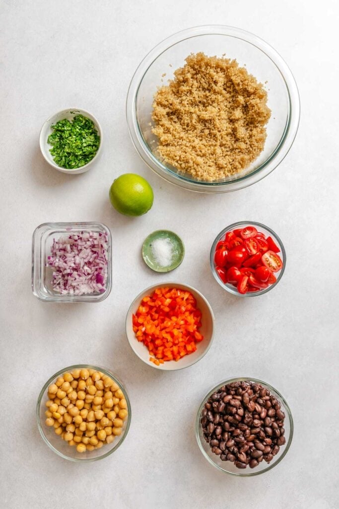 Ingredients for Southwest Quinoa Salad measured out on a white surface.