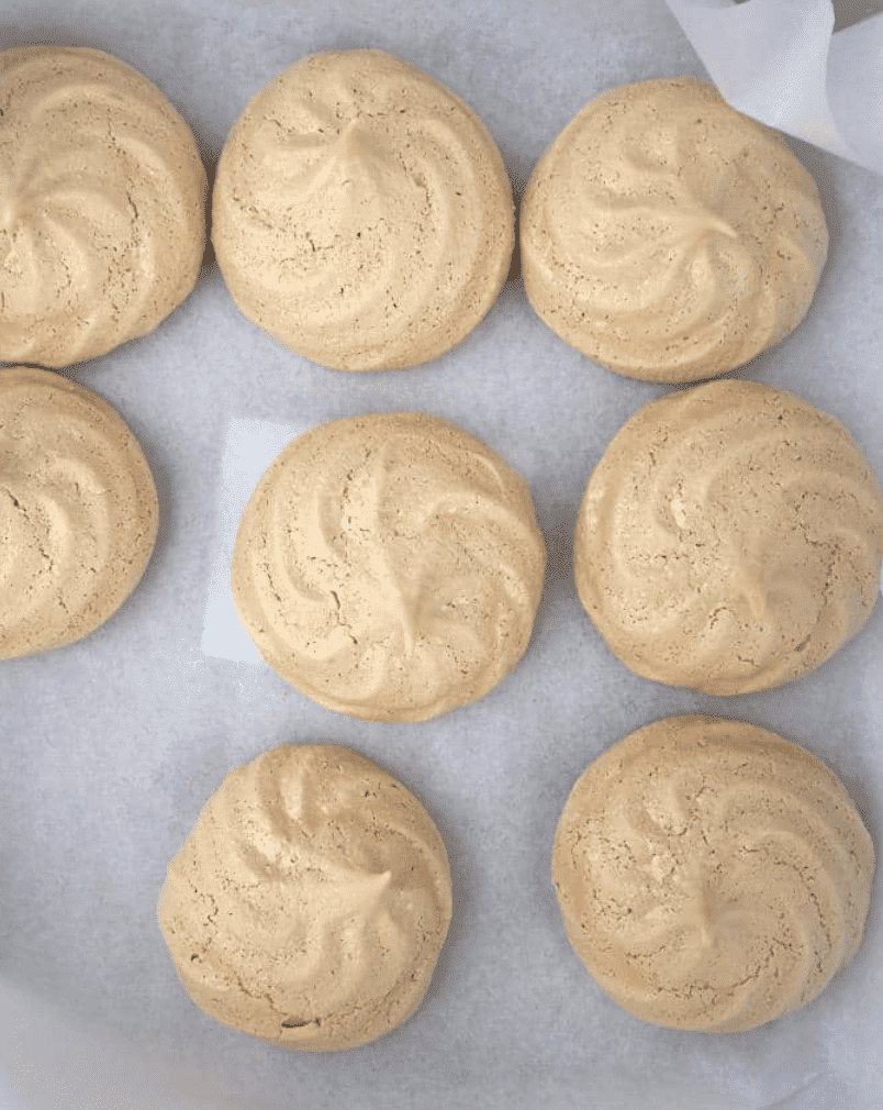 completed Coffee Meringues scattered on a white surface