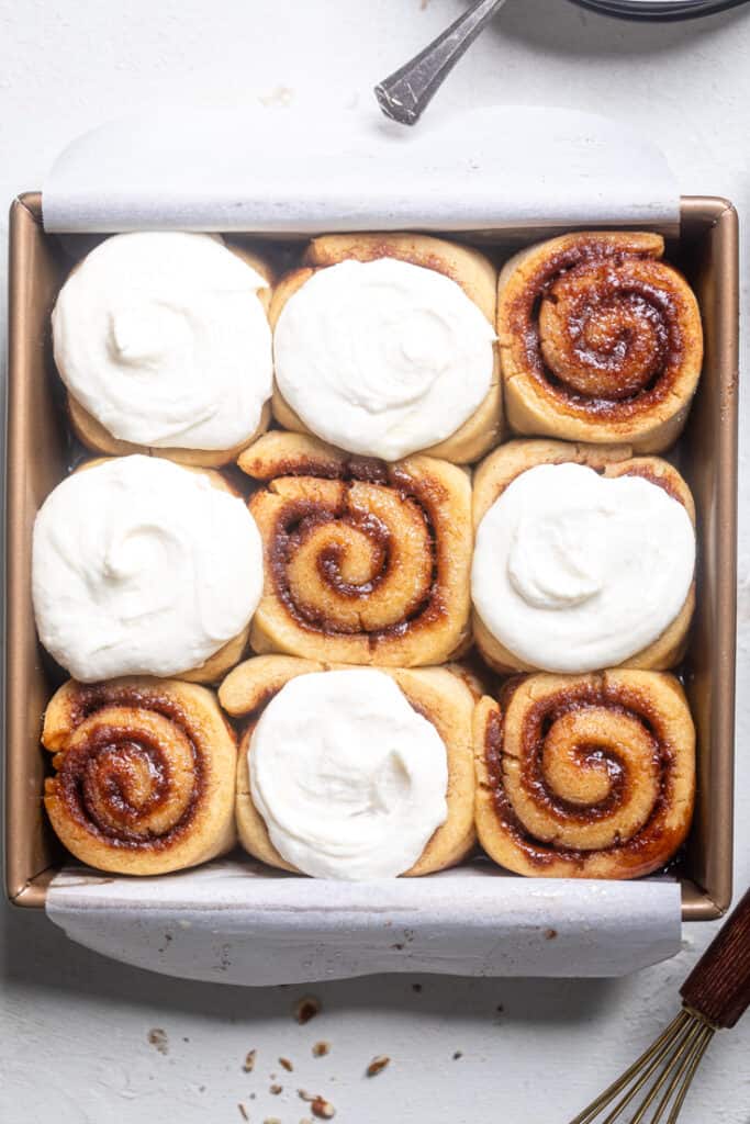 completed Cinnamon Rolls in a tray against a white background