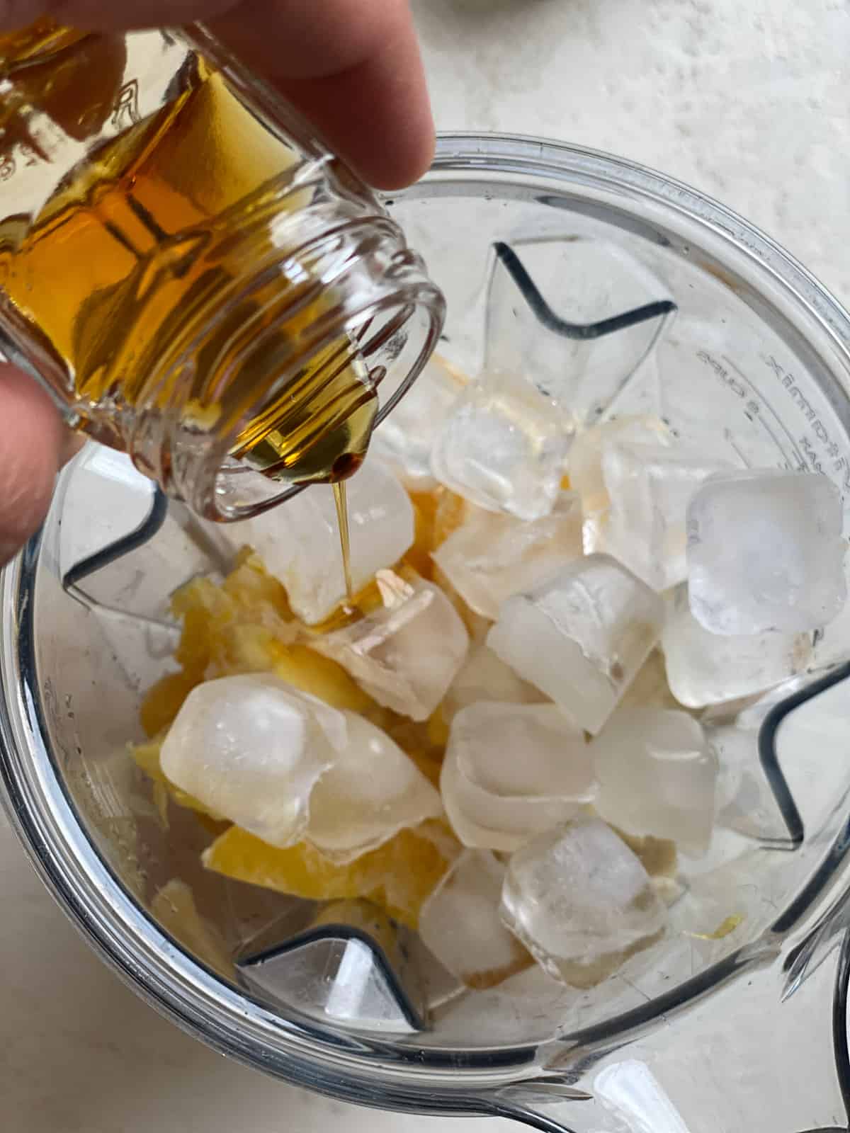 process shot of adding agave to blender