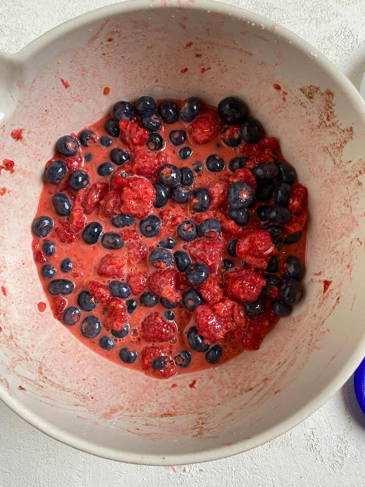 process shot of berries being added to a bowl