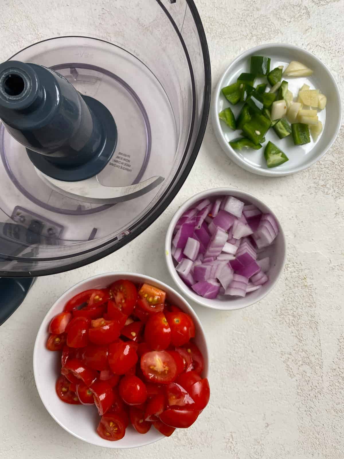 ingredients for Fresh Summer Salsa measured out against a white surface