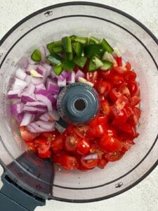 the addition of all ingredients in a food processor