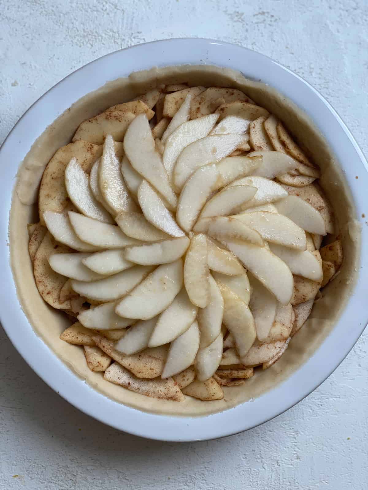 post addition of sliced pears added to top of pie filling
