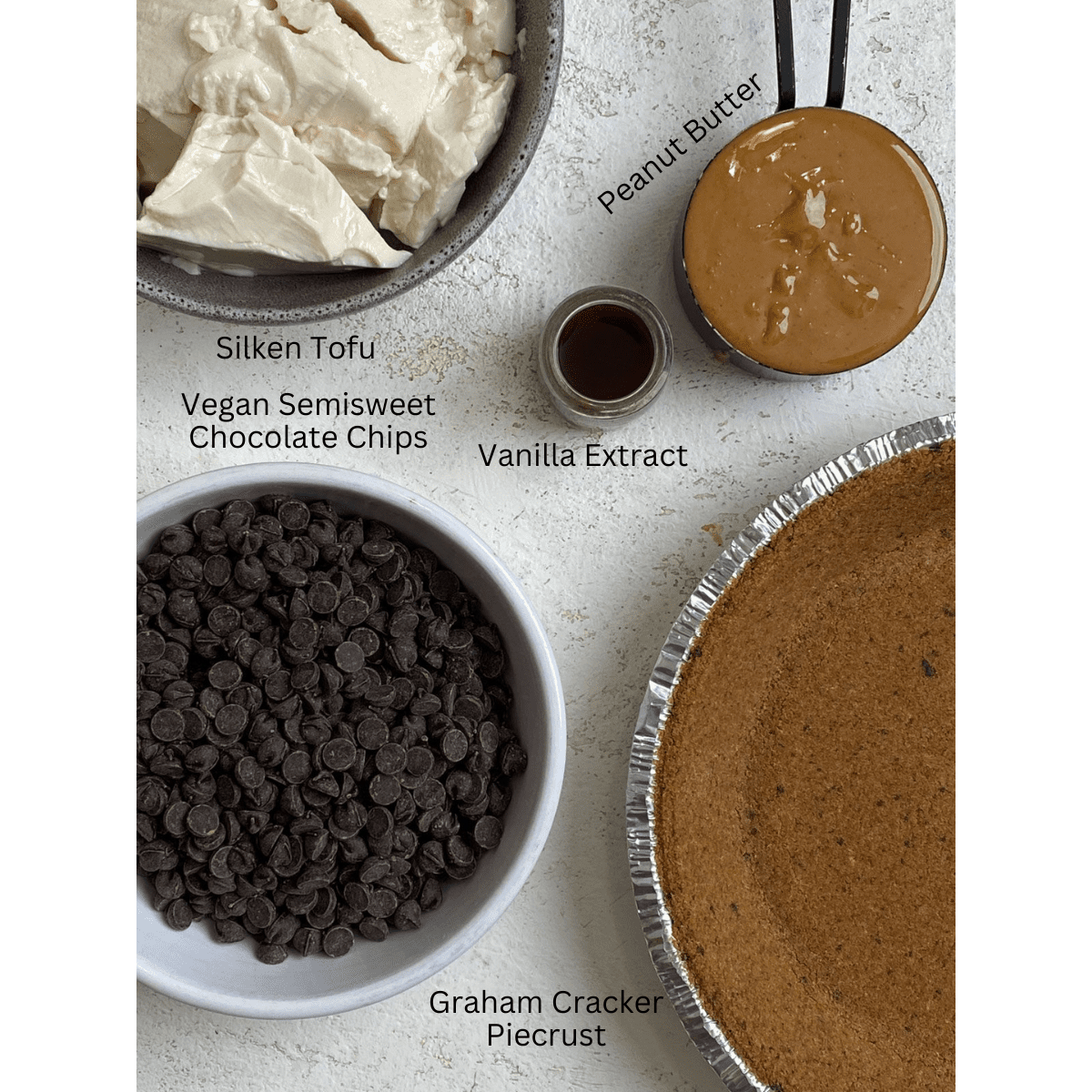 ingredients for Chocolate Peanut Butter Pie measured out against a light surface
