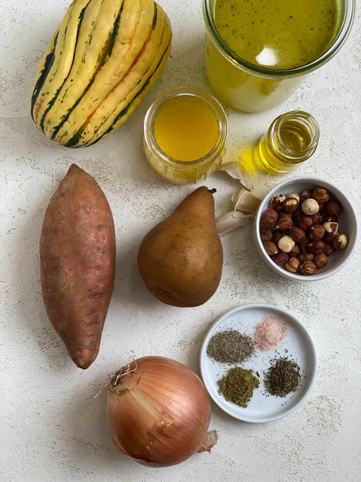 ingredients for Roasted Delicata Squash and Sweet Potato Soup against a light surface