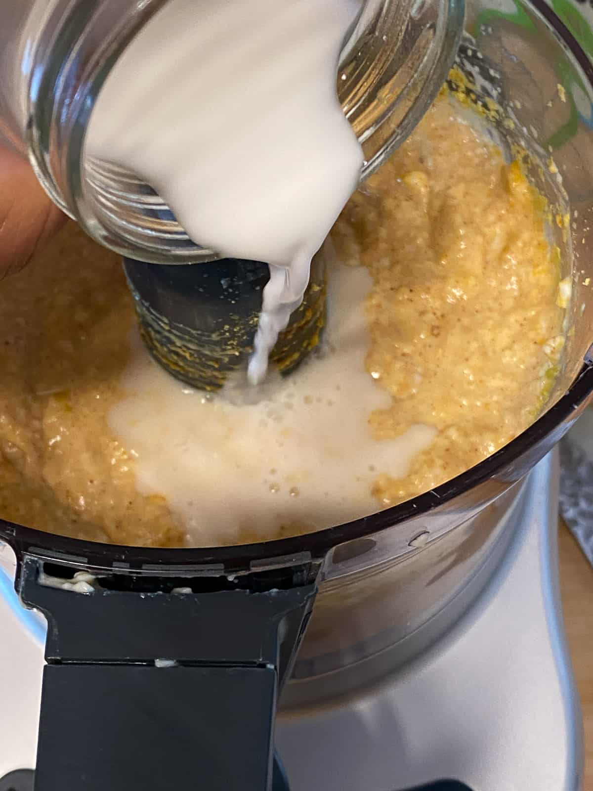 process shot of adding cornstarch mixture to blender