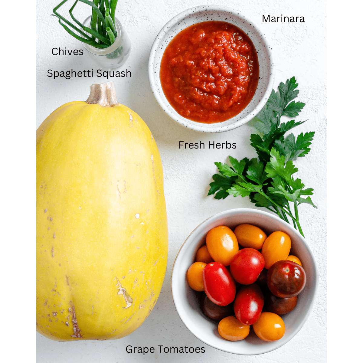 ingredients for roasted spaghetti squash measured out against a white surface