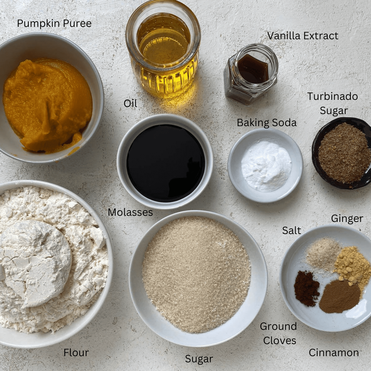 ingredients measured out for Soft Pumpkin Gingersnap Cookies against a white surface