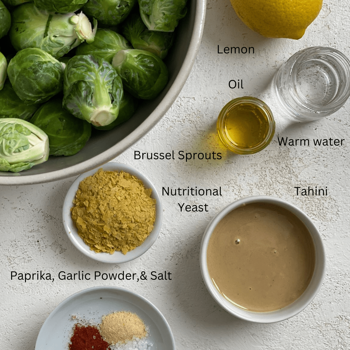 ingredients for Easy Vegan Brussels Sprouts spread out on a white surface