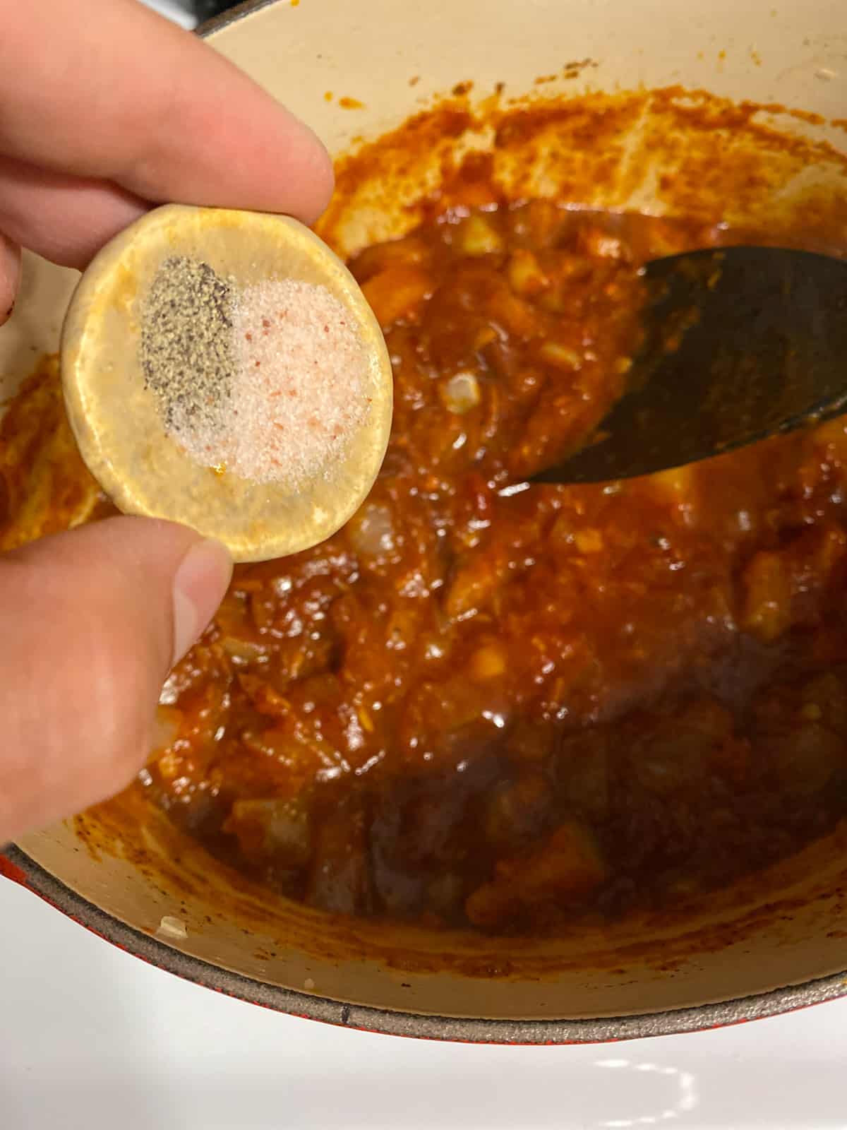 process shot of adding seasoning to pan