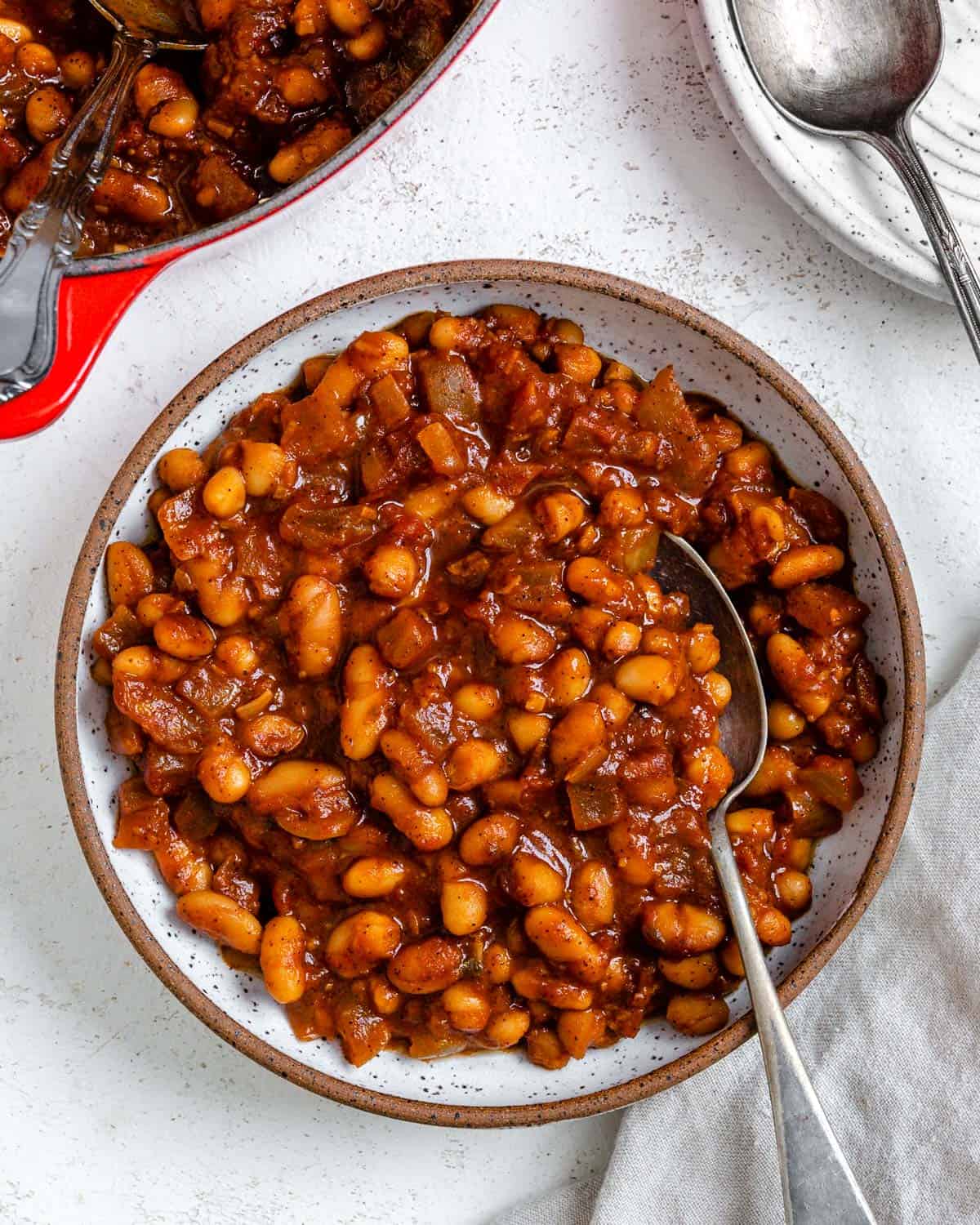 completed Homemade Vegan Baked Beans [Boston Style] plated in a bowl against a light surface