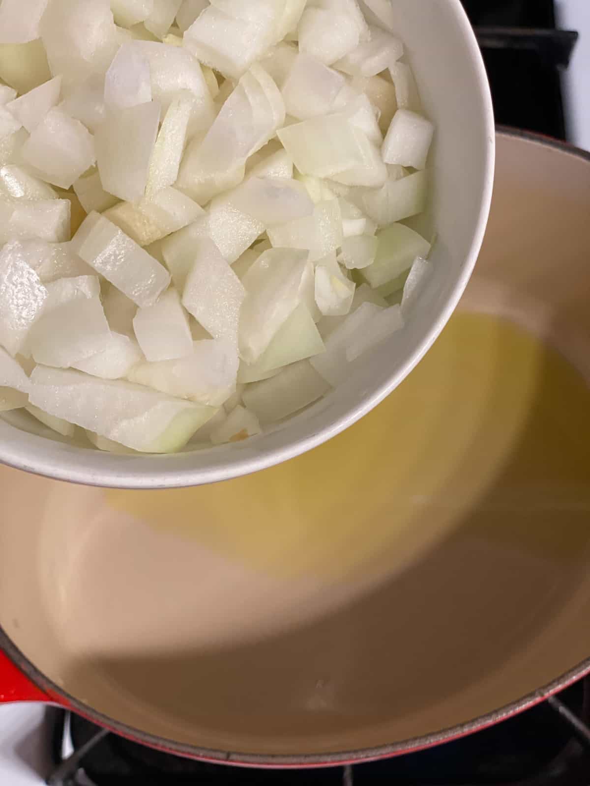 process of adding onions to pan