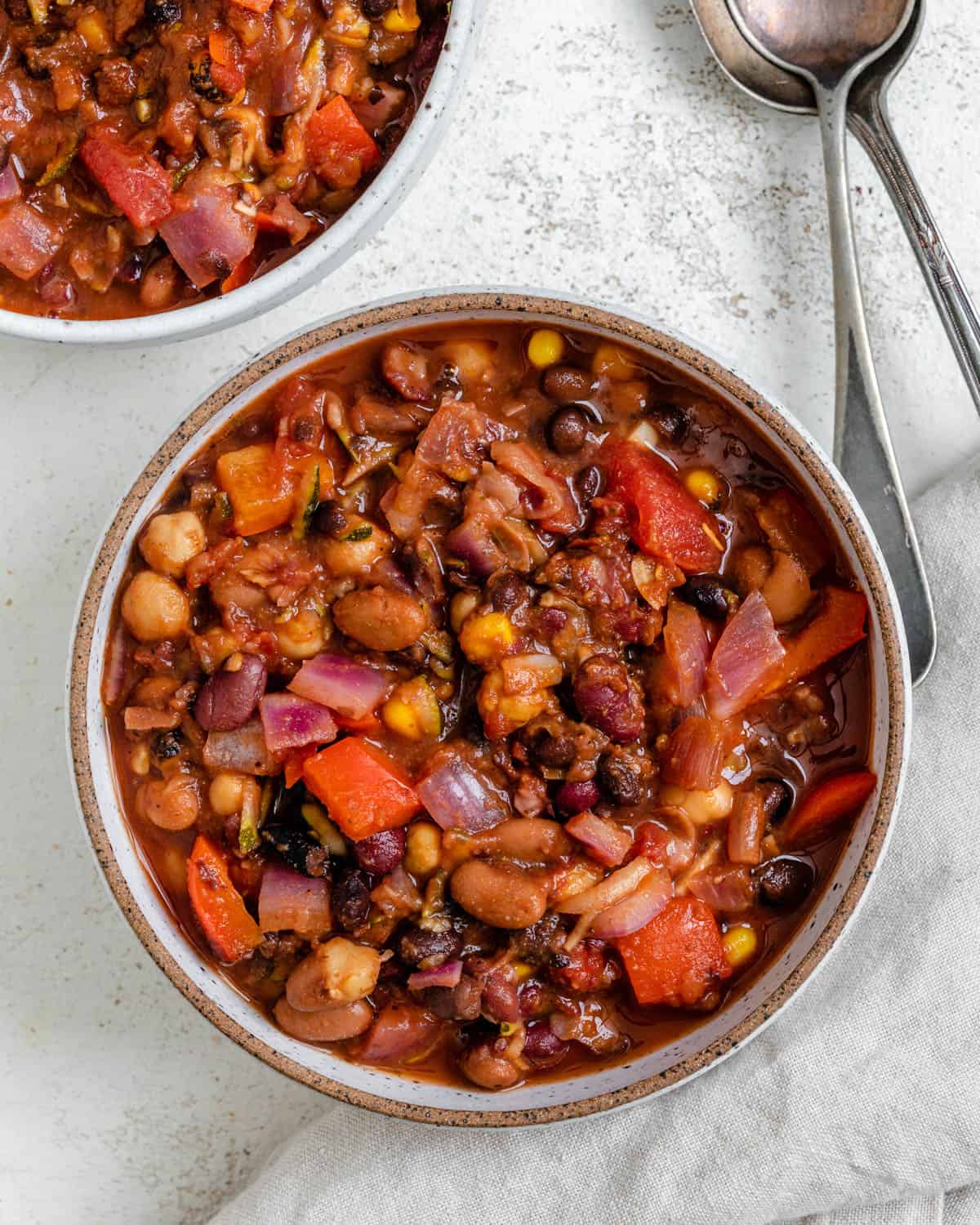 completed Vegan Bean Chili plated in a bowl against a light background