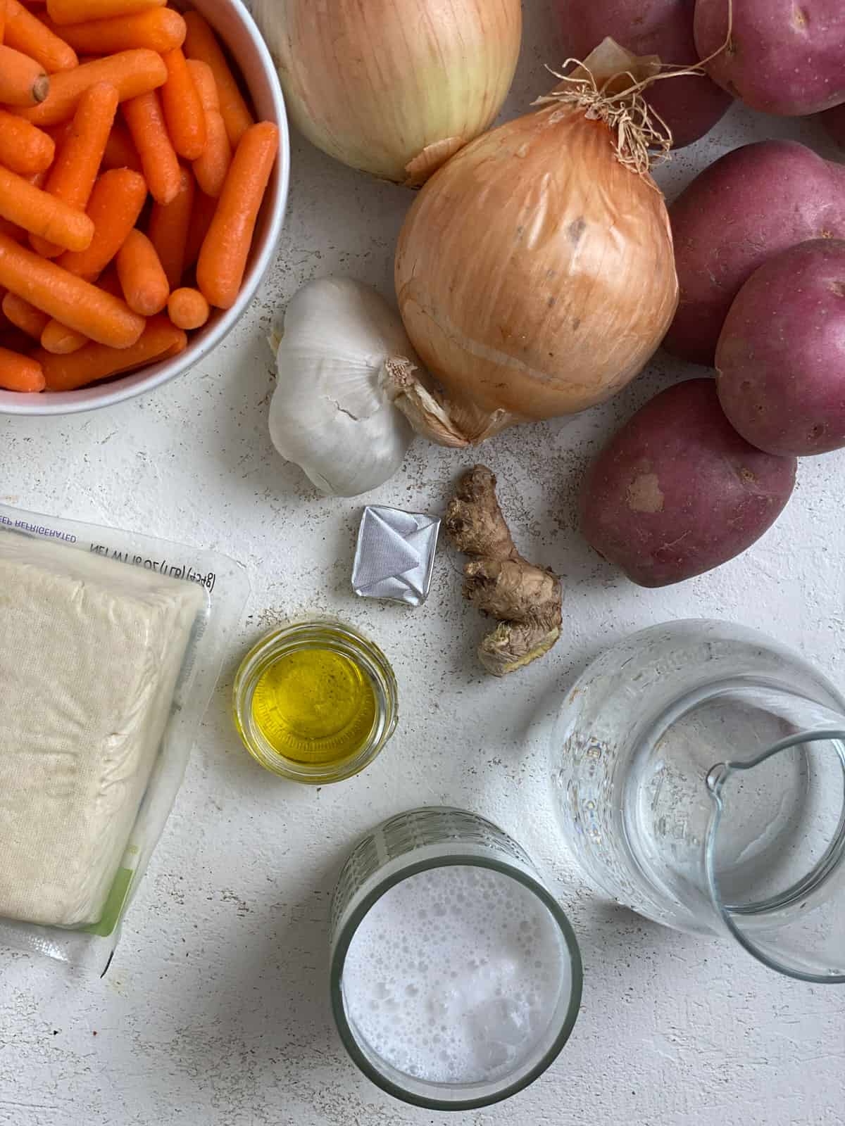 ingredients for Slow Cooker Red Thai Curry with Tofu measured out against a white surface