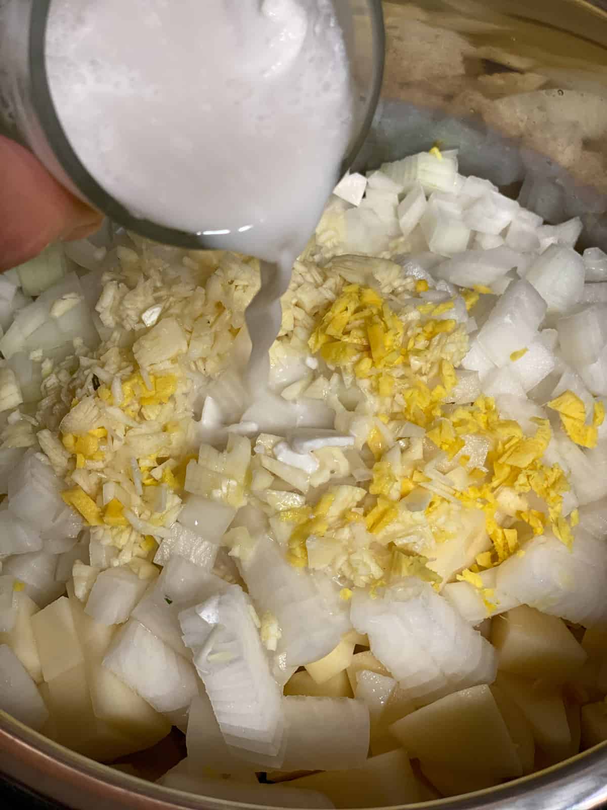 process shot of adding coconut sugar to pan