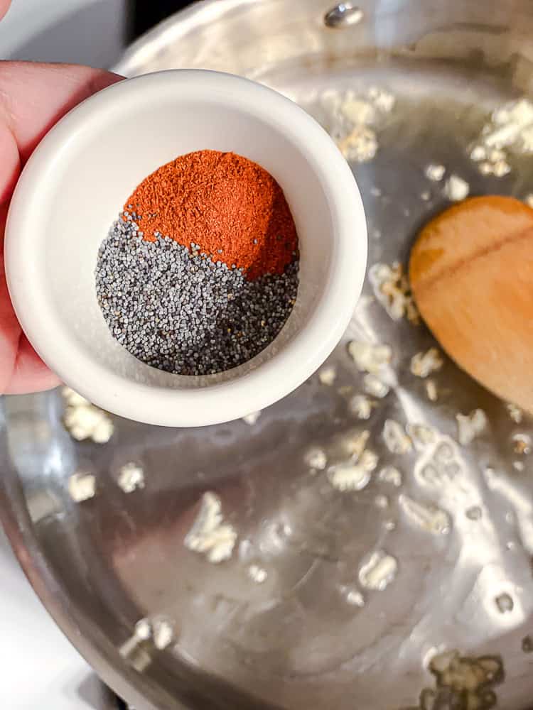 process shot of adding spices to pan