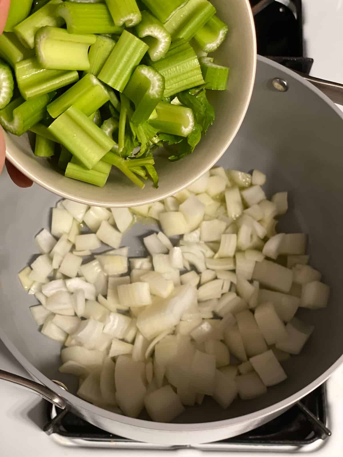 process shot of adding celery to pot