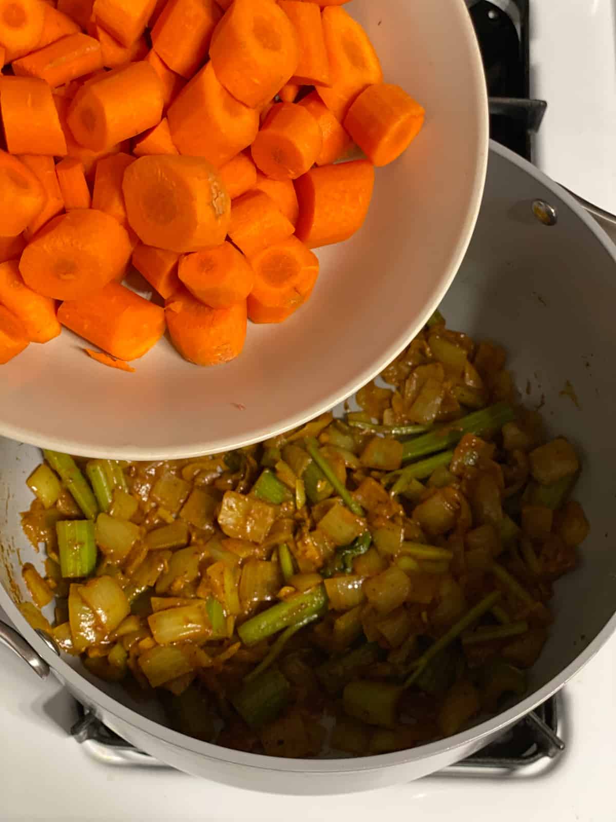 process shot of adding carrots to pot