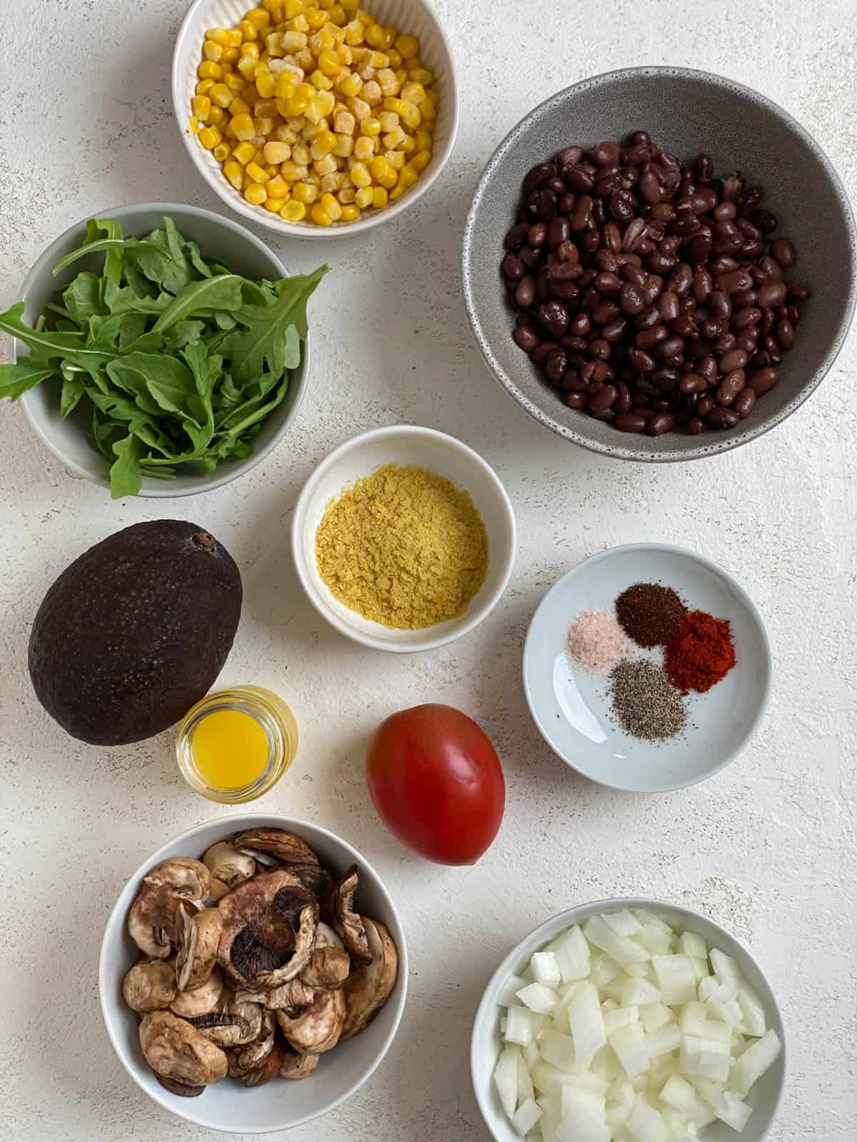 ingredients for Vegan Black Bean Tacos [2 Ways] measured out against a white surface