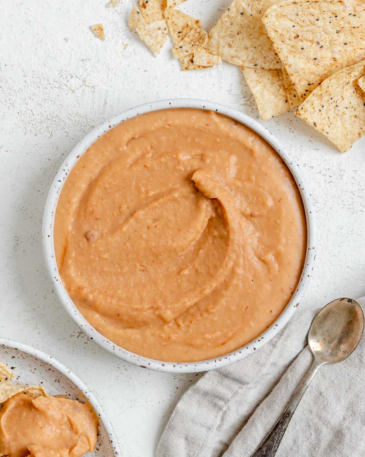 completed Spicy Chipotle White Bean Dip against a white surface