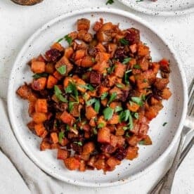 completed One-Pan Root Vegetable Hash plated on a white plate