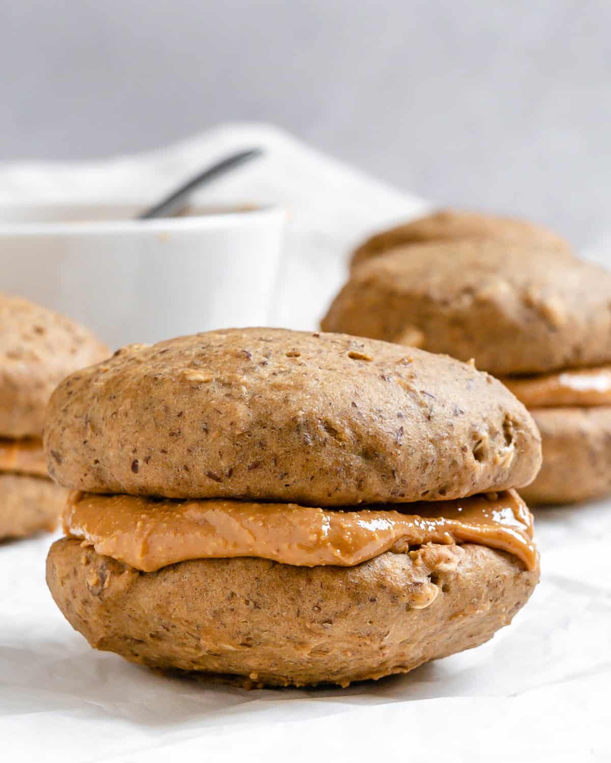 completed Vegan Peanut Butter Cookies [With Filling| Sandwich Cookies] on a white surface