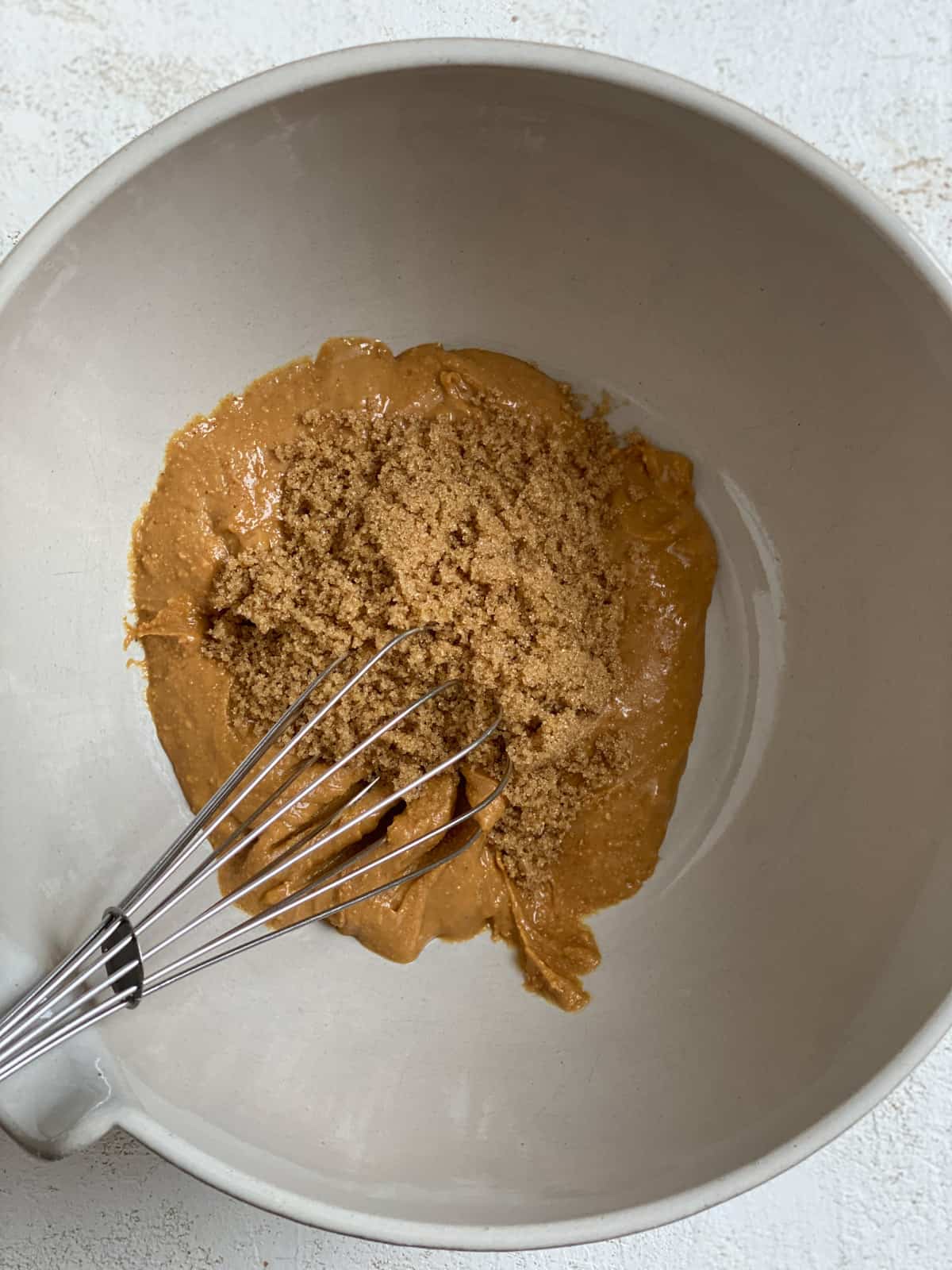 process shot of mixing peanut butter mixture in bowl
