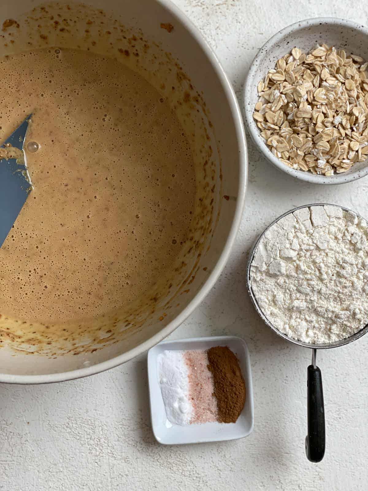 bowl of peanut butter mixture alongside additional ingredients