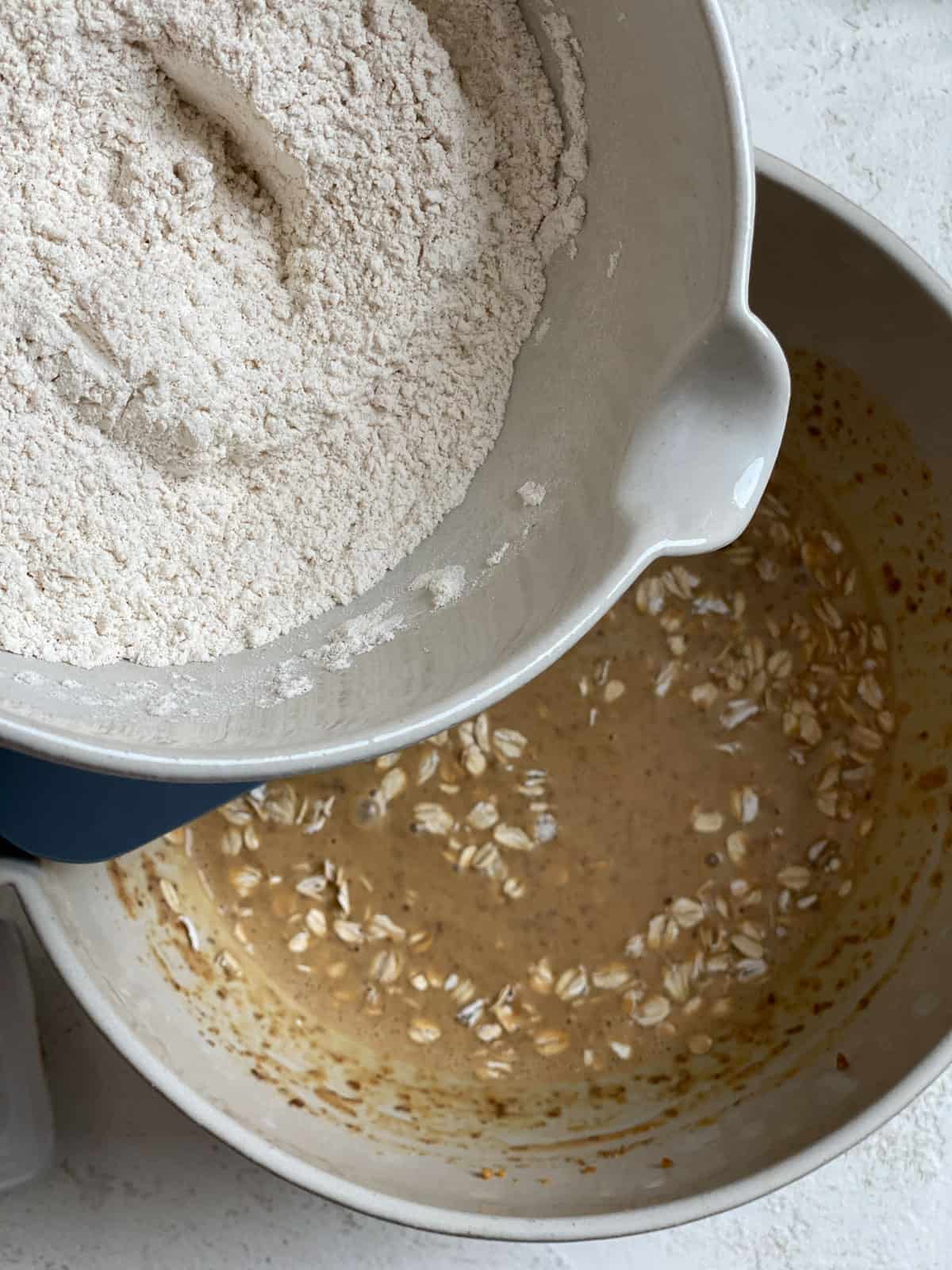 process shot of adding flour to bowl