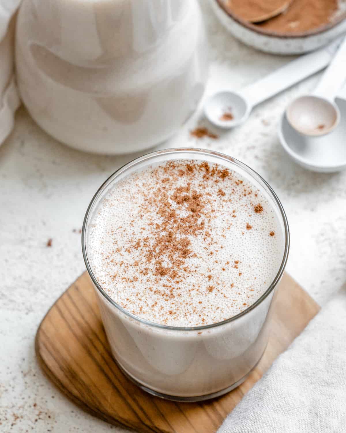 completed Easy Vegan Eggnog on a brown and white surface