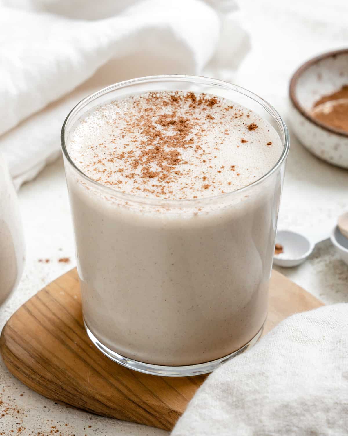 completed Easy Vegan Eggnog on a brown and white surface