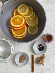 ingredients for Lemon Cinnamon Ginger Tea measured out against a light background