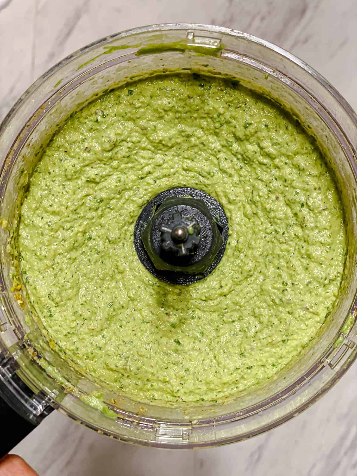 process shot of Amazing Avocado Pesto Pasta ingredients in food processor