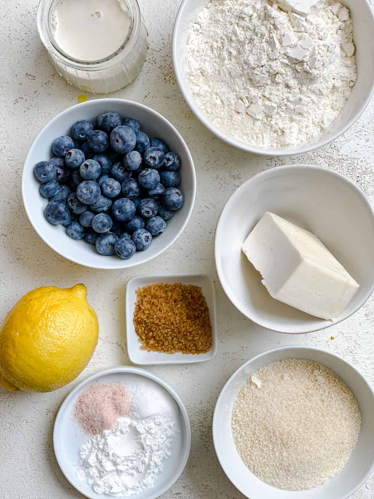 ingredients for Vegan Lemon Blueberry Scones measured out against a white surface