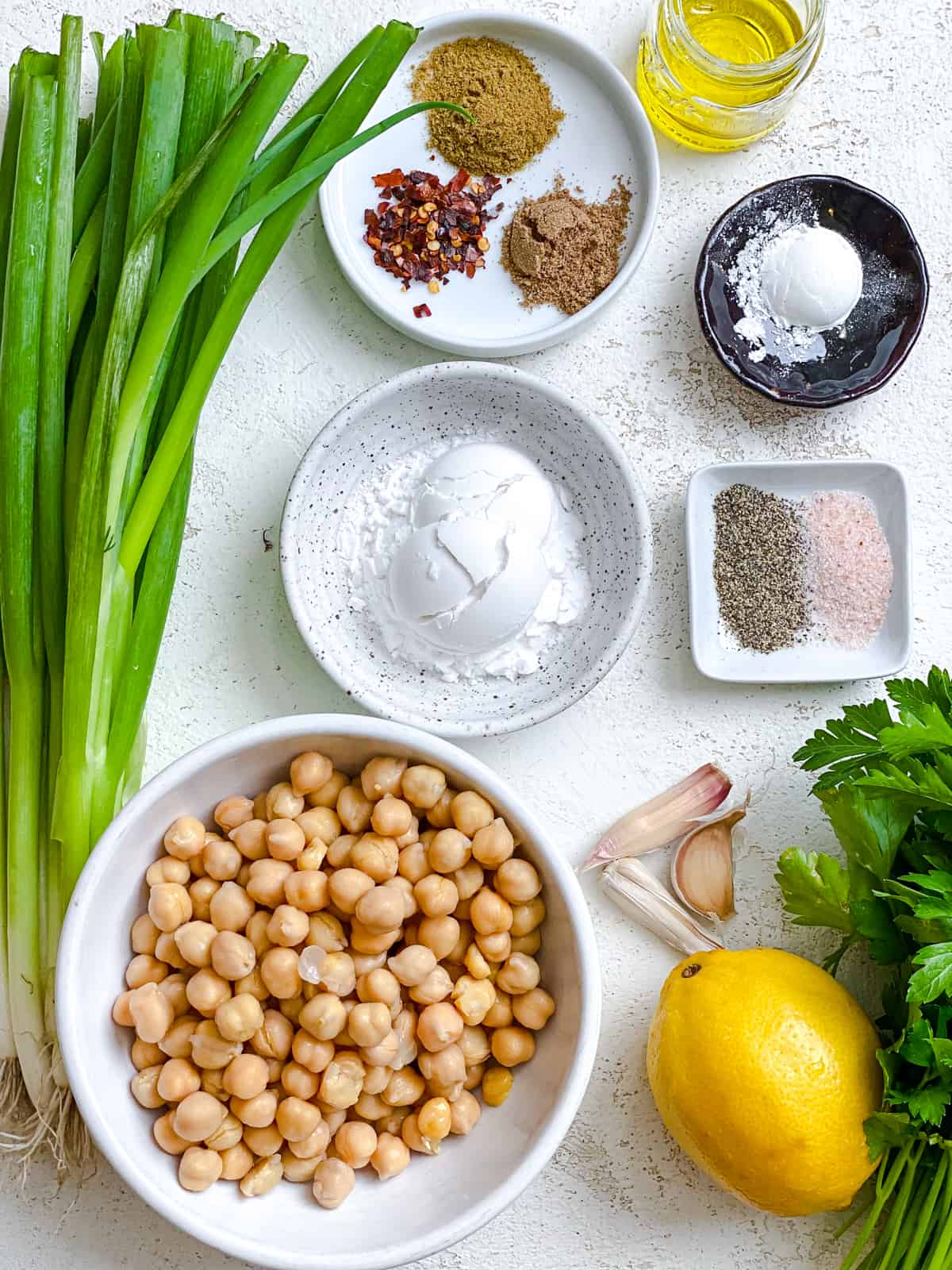 ingredients for Healthy Baked Falafel measured out against a white background