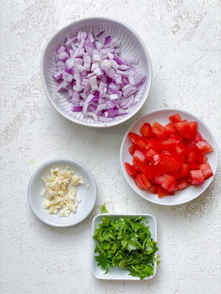 ingredients for Easy Guacamole measured out against a white surface