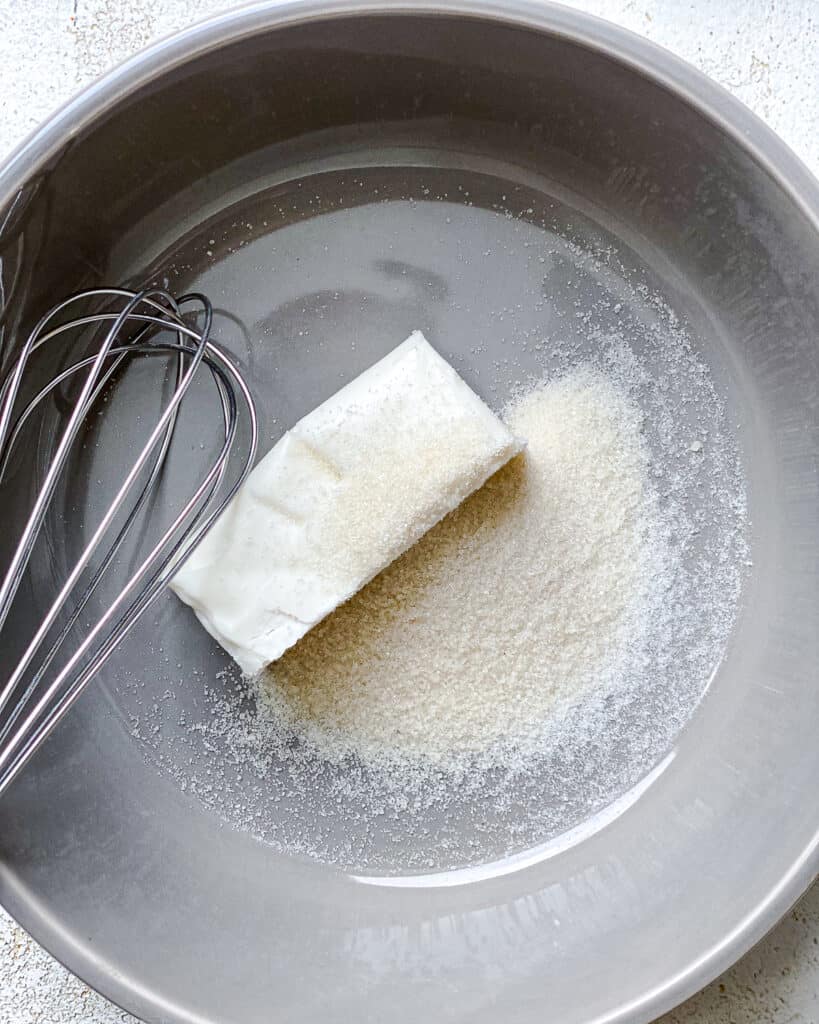 process of adding butter to a pan