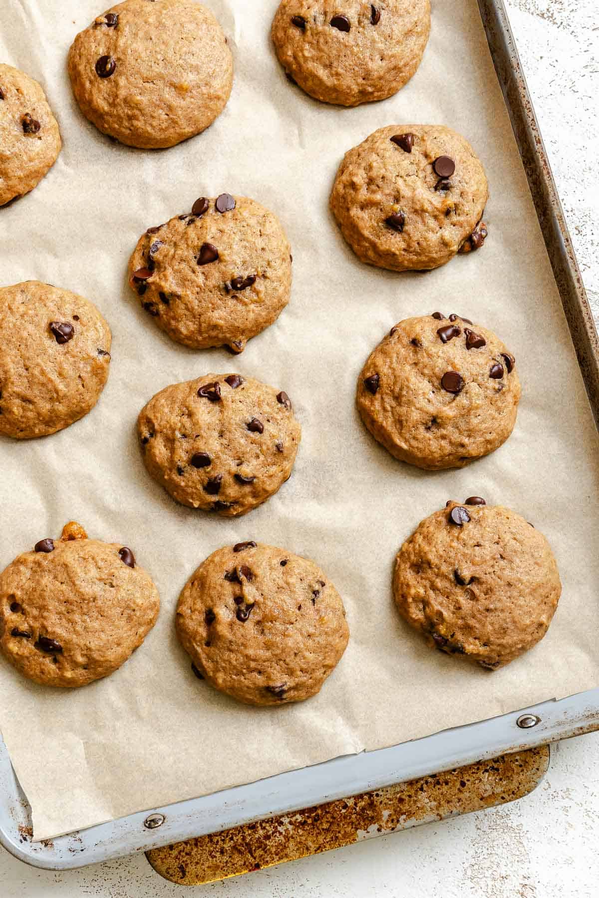 Process shot showing post baked cookies on baking sheet.
