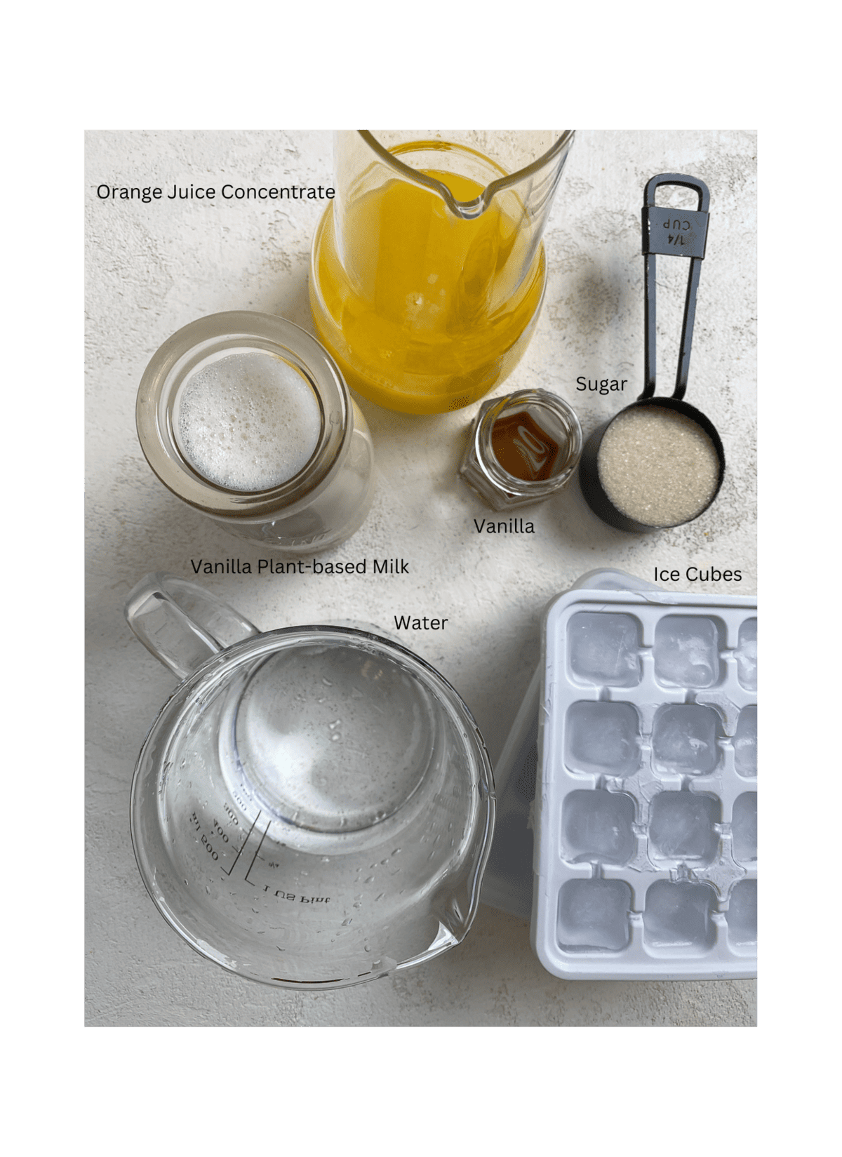 ingredients for Easy Orange Julius Smoothie Recipe measured out against a white surface