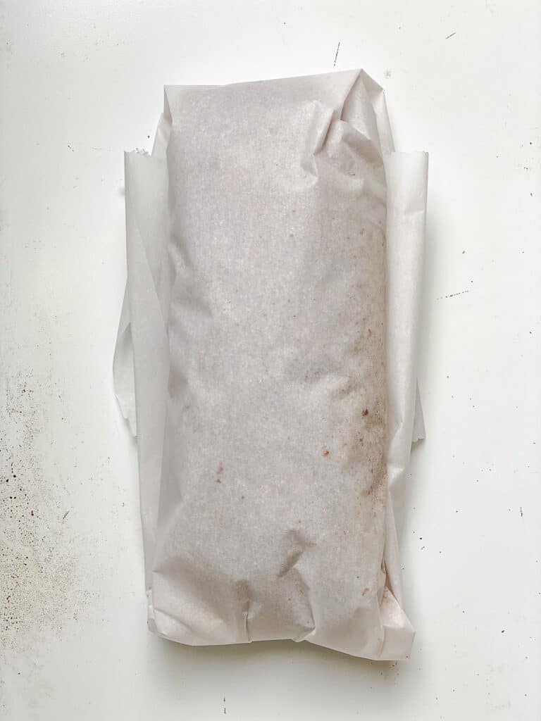 process shot of wrapping seitan in parchment paper