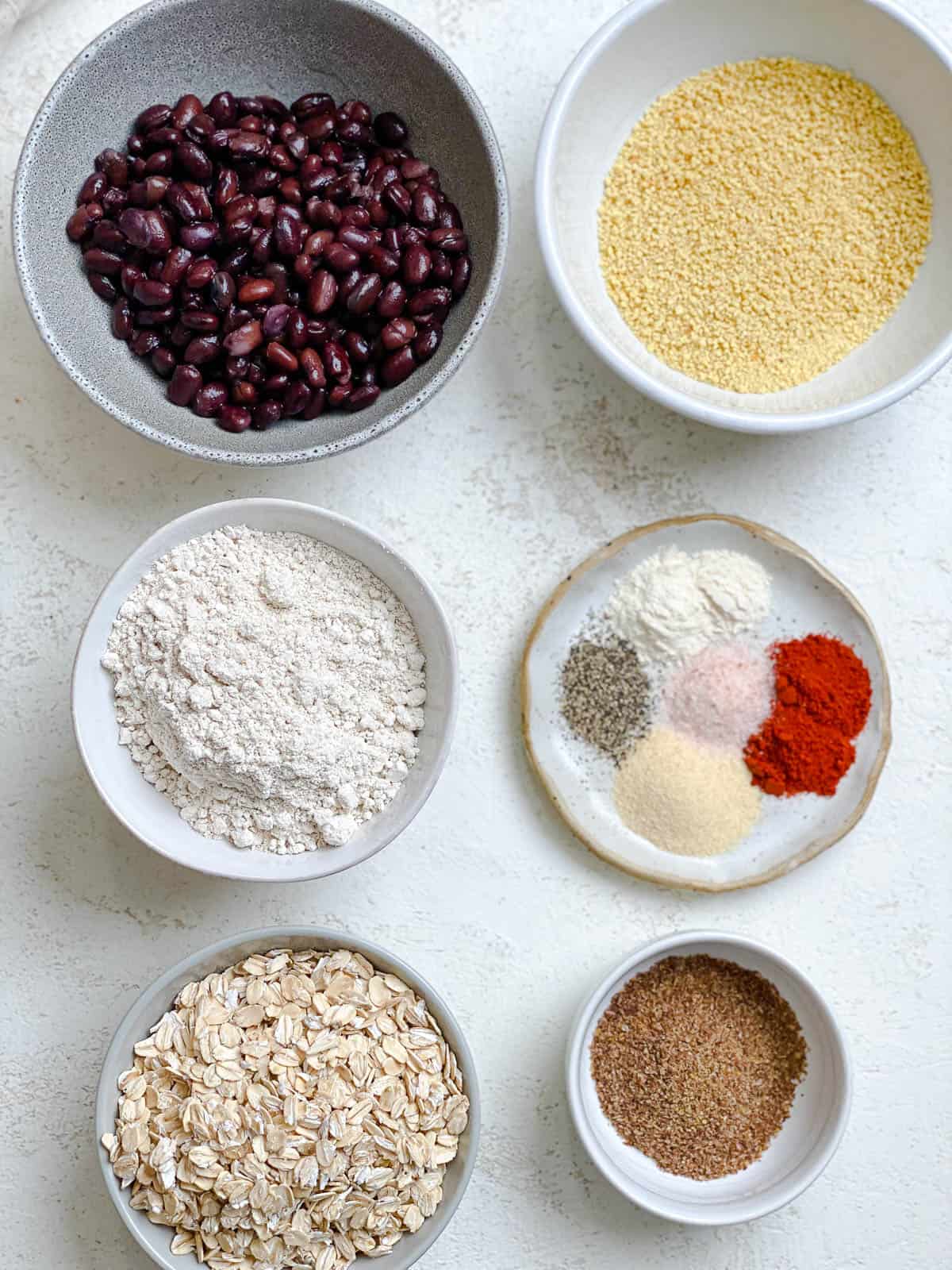 ingredients for Easy Black Bean Meatballs measured out against a white surface