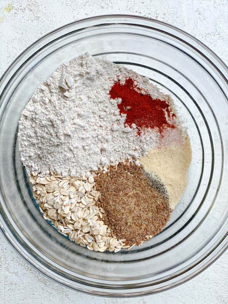 flour and spice mixture added to glass bowl