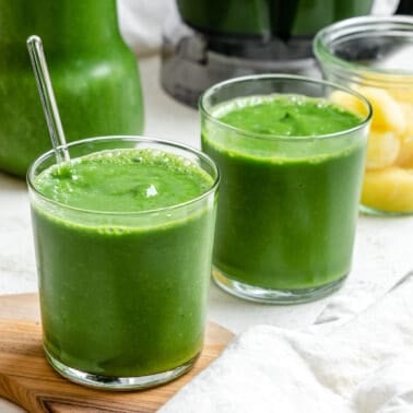 two glasses of completed Kale Pineapple Smoothie